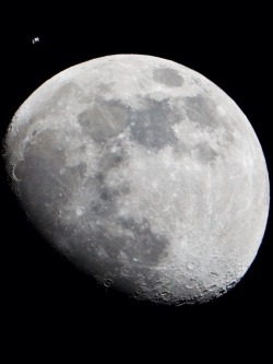 crookedindifference:  Moon and International Space Station JSC2012-E-017827 (4 Jan. 2012) —- The International Space Station can be seen as a small object in upper left of this image of the moon in the early evening Jan. 4 in the skies over the Houston