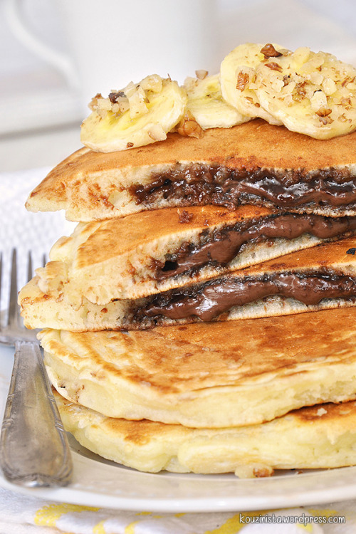 deliciousanddivine:  sweetoothgirl:  Nutella Stuffed Pancakes I’ve made Nutella stuffed pancakes before…but they were Nutella stuffed Churro pancakes…immediately dip them in cinnamon sugar when you take them off the griddle…you won’t be sorry.