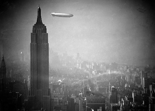 The LZ 129 Hindenburg floating past the Empire State Building over Manhattan, on its way from German