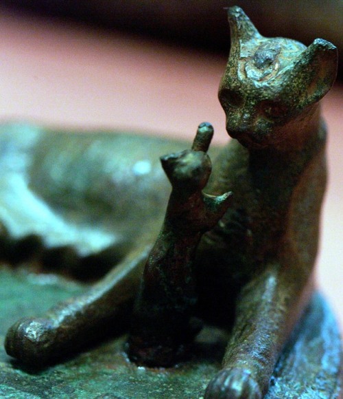 amntenofre:the Goddess Bastet in Her form of sacred cat playing with Her kitten;detail of a bronze s