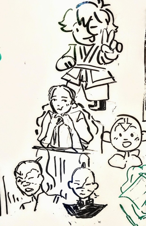 Whiteboard doodles of Katara, Zuko, and Aang.