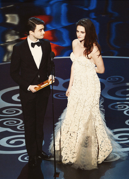 absofreakinlutely:  Actor Daniel Radcliffe and actress Kristen Stewart present onstage