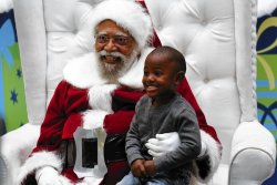 badbilliejean:  racebending:  nedhepburn:  At South L.A. mall, a Claus with quite an effect.   For nearly a decade, Patterson has been the main attraction at Baldwin Hills Crenshaw Plaza during Christmastime: a rare black Santa Claus in a sea of white