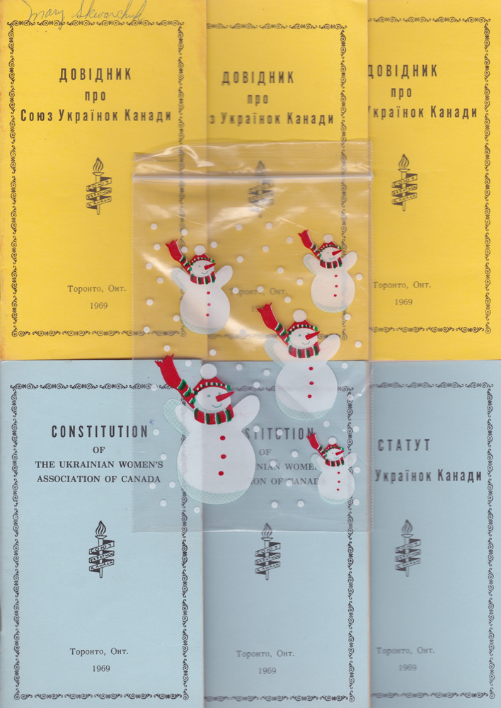 “Oh yeah, mmm hmm. Now that is our constitution for the Ukrainian Women’s Association. It’s everything we can and can’t do in and within our church. And the little snowmen…where did they come from? Oh, a bag. The little bags for popcorn.”
