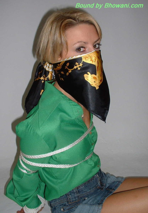 graybandanna:  Sabrina tied up in a green blouse with both a scarf cleave gag and a scarf over the nose gag