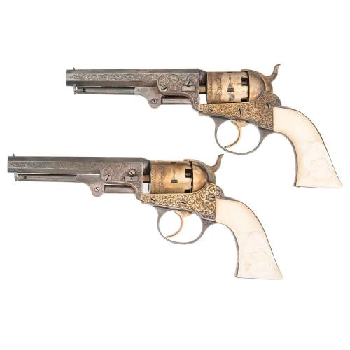 A pair of gilt and silver engraved percussion revolver with ivory grips. Produced by Cooper & Co