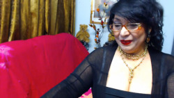 Black haired busty grannyâ€¦lots of make-up