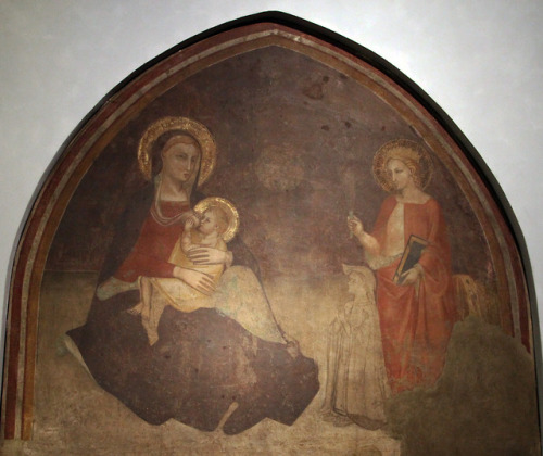 Madonna breastfeeding and St. Catherine (14th c.).Fresco in Cappella Della Pura. Santa Maria Novella