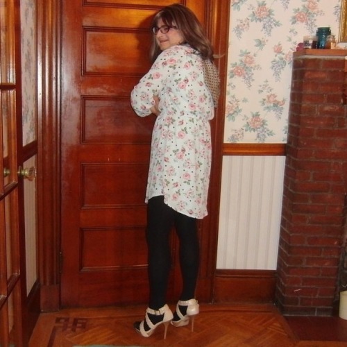 Rear view of me, standing, wearing my new purple cat-eye glasses, floral shirt dress, and Annika hig