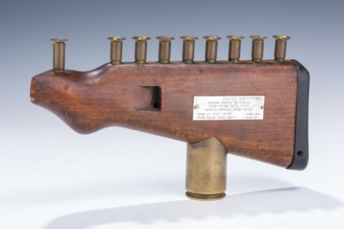 Menorah crafted from a rifle butt with dedicated to Gen. Yitzchak Rabin, 1966.