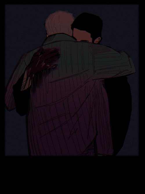 chris and josh hugging. josh's hand is covered in blood. ref: rob lang