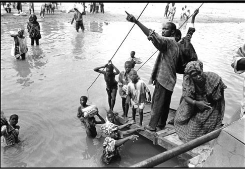 Kadir van Lohuizen: Niger - ocean to ocean (West Africa, 1996)The brown God runs from Guinee, very c