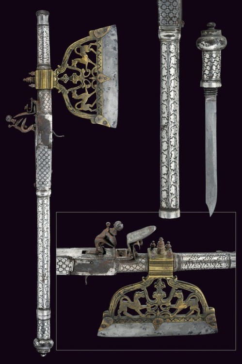 An axe and flintlock musket combo weapon with dagger concealed in the handle.  Originates from India