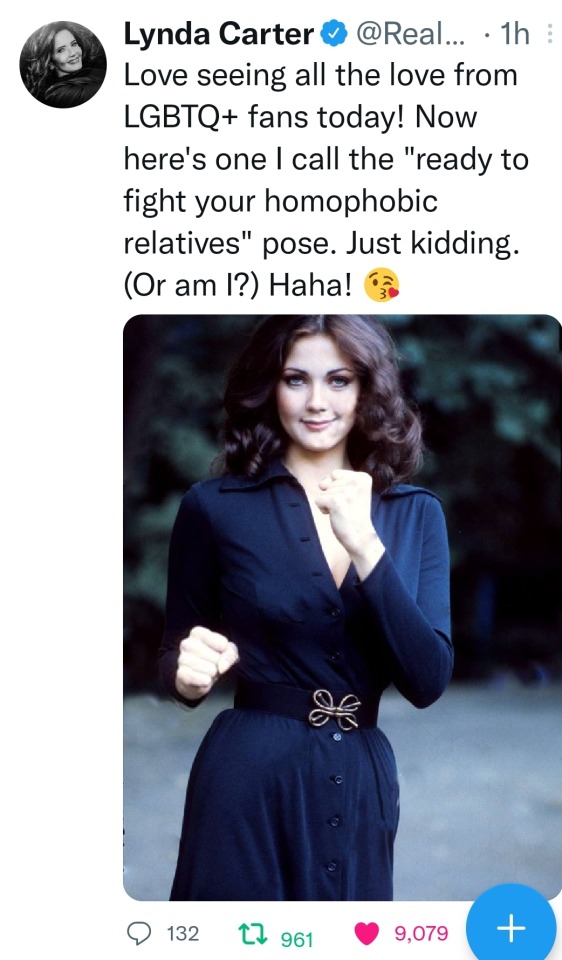 screen cap of image of Lynda Carter in a dark dress with fists up ready to fight. the caption says "Love seeing all the love from LGBTQ+ fans today! Now here's one I call the "ready to fight your homophobic relatives" pose. Just kidding. (Or am I?) Haha! "