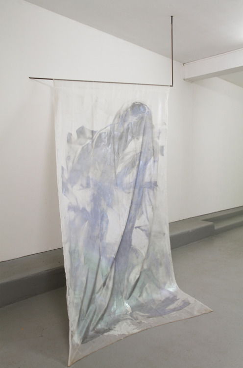 JAANA LAAKKONEN
Sharing A Room, A Water Bottle And Who Knows What!
2016
Black tarp on a grey embossed floor. Greenish-yellowish, a slightly see-through tarp in front of a cinder block wall painted white. Located on the right side. On the left, black...