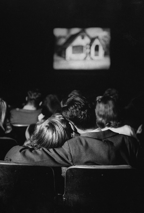 vintagegal: Teenage couple in a movie theater,1944. Photo by Nina Leen.