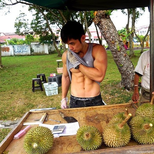 keepemgrowin:  buzzfeed:First, there was the Hot Bean Curd Vendor in Taiwan. Now there’s a Hot Durian Fruit Seller in Malaysia. This is a good trend. Forget the fruit… can I take this muscle hottie home?
