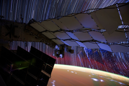 skunkbear:  These are a couple years old, but my love for them springeth anew. Long exposure photographs (by astronaut Don Pettit aboard the International Space Station) turn human lights into neon threads, stars into shining strings, and lightning storms