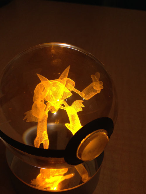 sixpenceee:These crystal Poke Balls hold a 3D etched pokemon inside them that glows with the LED lig