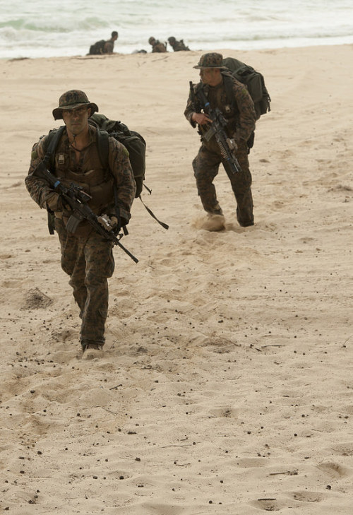 militaryarmament:  Marines assigned to 3rd Marine Division, III Marine Expeditionary Force arrives at Bellows Beach for a beach assault exercise during Rim of the Pacific Exercise 2014. July 27, 2014.