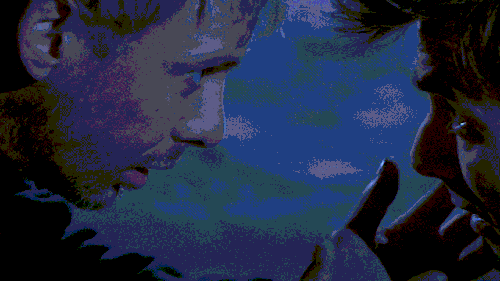 A gif of the Master (John Simm) reaching for the Tenth Doctor (David Tennant)'s face with shaking hands and bringing their foreheads together.