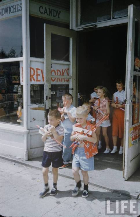 Stocking up on fireworks for the 4th of July(Nat Farbman. 1954)