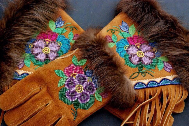 Metis gloves made of leather and fur, with fringe and colorful beaded flowers.