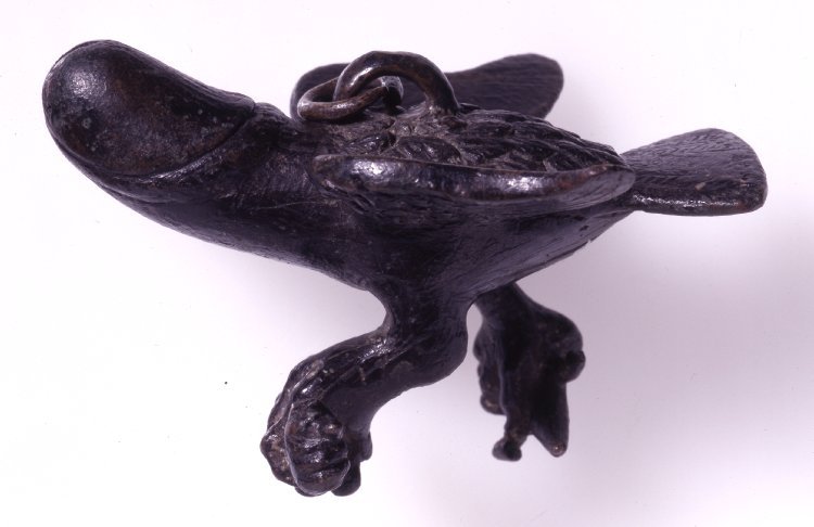 via-appia: Bronze tintinabulum, figure of eagle with head in form of phallus holding
