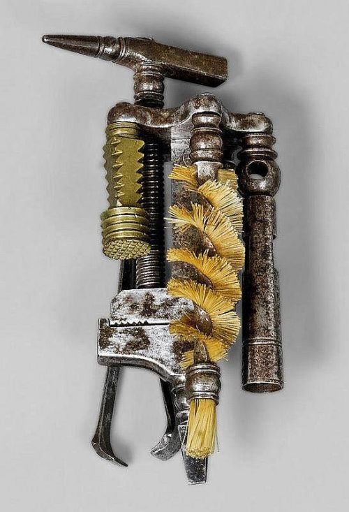 Combination tool, 19th century. Wrought iron. With hammer, screw driver, vice and various cleaning u