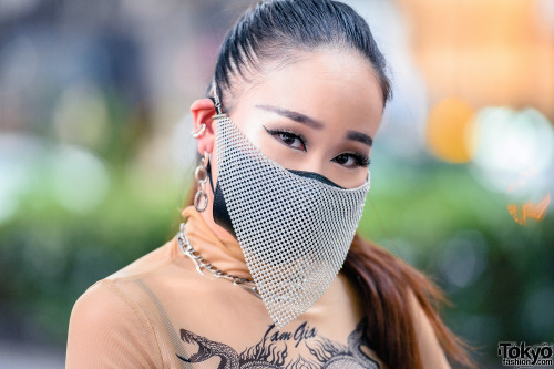 Japanese nurse Saya on the street in Harajuku wearing a chainmail face mask with a sheer top by I.Am