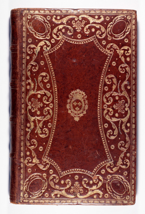 An unusual elaborate gilt binding which shows a gilt coat of arms of Louis XV?dating from the mid 18