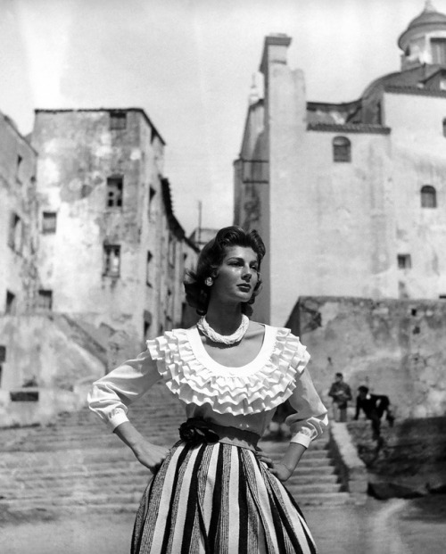 Fiona Campbell-Walter with Corsican architecture for Nouveau Femina, June 1954. Photograph by George
