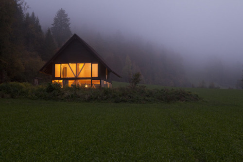 doeyzooey:  Zurich-based architect Pascal Flammer designed this timber house in Balsthal, Switzerland, which is sunken 2.46ft (75cm) with ground-level wrap around windows, connecting it with nature in a special, unique way.  Please….. I want it