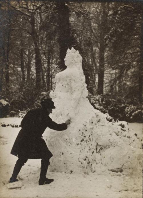 A man carving Queen Victoria out of snow on a winter’s day around 1890. Unfortunately the iden