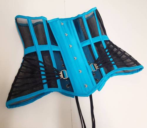 Custom blue satin and black sheer corset w/ fan-lacing hip detail. This lil cutie is on it’s w