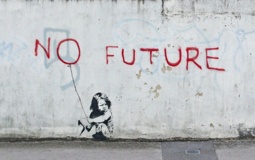 optates:  Banksy, a street artist whose identity remains unknown, known for his provocative stenciled pieces in the late 1990s.  