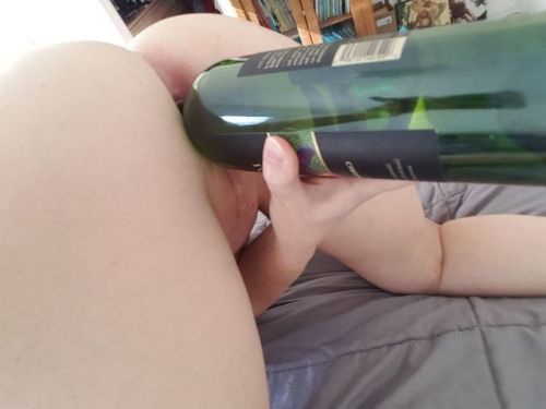 stick-it-inside: pussyfucktoy: Fun with both holes. Wine bottle in pussy