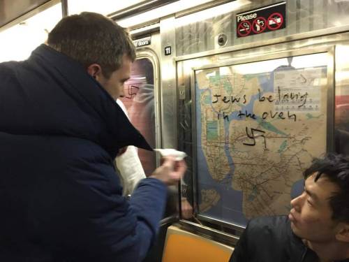 sixpenceee:Manhattan subway gets covered in Swastikas on every advertisement. One guy got up and sai