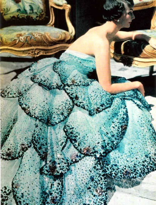 Model reading in &ldquo;Junon&rdquo; dress, fall/winter 1949–50, by Christian Dior. Pale-blue silk n
