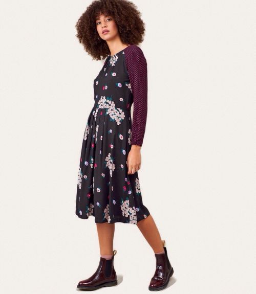 ♡ Winter florals meet fuchsia polka dots in this @emilyandfin dress! ♡ Enjoy free delivery for limit