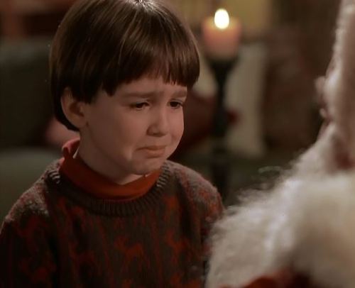 The beauty of this brown and red reindeer sweater made Charlie cry in this scene from the great 90s 