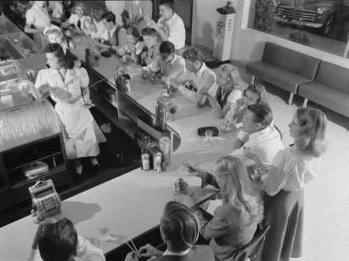 Teens, 1947Teens gather at the counter of a local malt shop