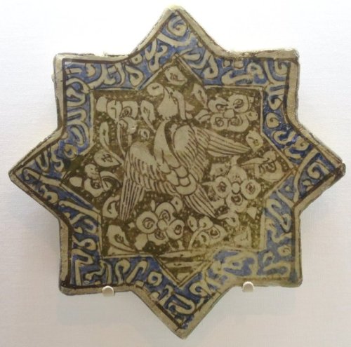 Star tile with a phoenix.  Artist unknown; early 14th century.  From Iran (probably Kashan now in th