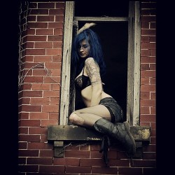 zephyrsuicide:  Can I put “daredevil badass” on my resume? Hanging out of second story windows wile @jbrettprincephotography takes amazing photos of me today! #suicidegirls #sg #bluehair  &lt;3