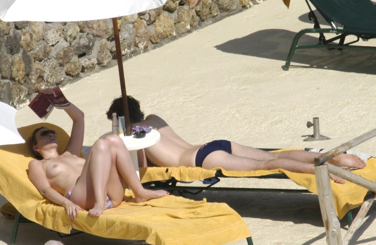 toplessbeachcelebs:  Toni Collette (Actress) sunbathing topless in Italy (December