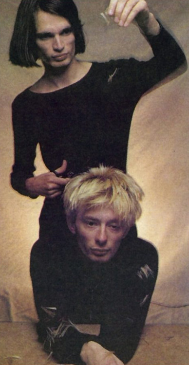 yorkeos:…“Photogenically,” Jonny says, looking over at Thom who is searching for volunteers to cut h