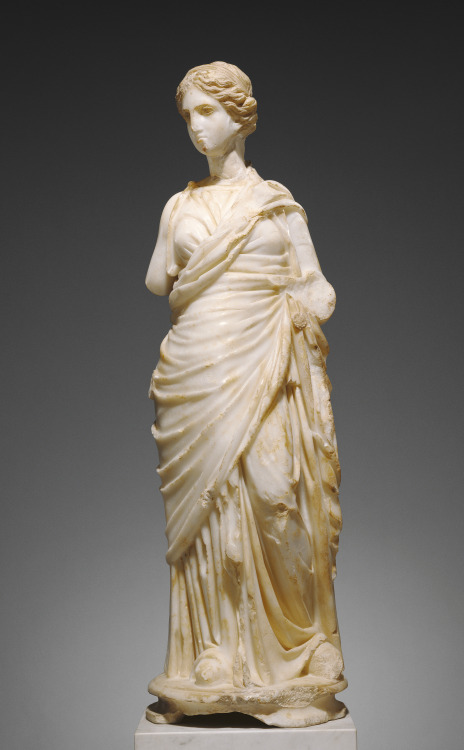 Statue of a muse, probably Clio, the muse of history. Roman, Imperial Period, c. 200 A.D. Marble wit