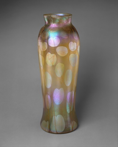 met-american-decor:Vase, Louis Comfort Tiffany, ca. 1900, American Decorative ArtsGift of Robert and Gladys Koch, 1999Size: H. 22 in. (55.9 cm)Medium: Free-blown Favrile glasshttps://www.metmuseum.org/art/collection/search/16755