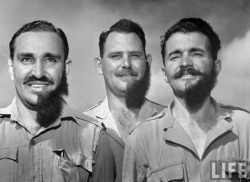 Margaret Bourke-White - Three South Africa air force men at the end of Voortrekker celebration honoring the country&rsquo;s early settlers, displaying their half-shaved off beards which they grew to participate in the event&rsquo;s pageant, Pretoria,