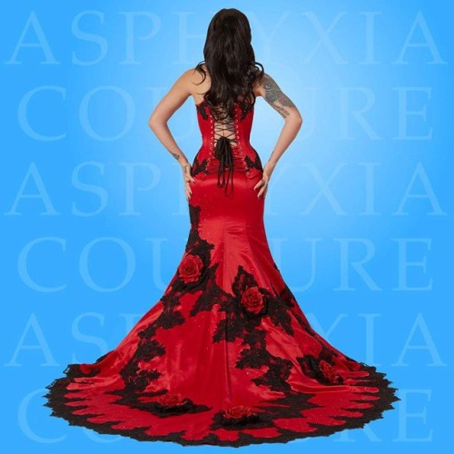 Red delustered satin and black alencon lace bridal corsetted gown. For all orders & enquiries, p